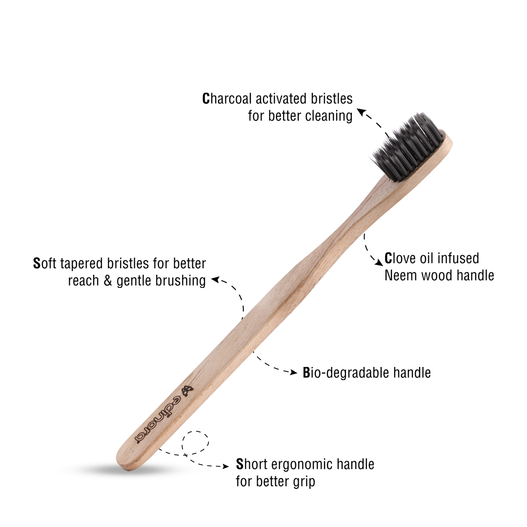 Edinora soft toothbrush with clove infused neem wood handle - tapered, charcoal infused bristles